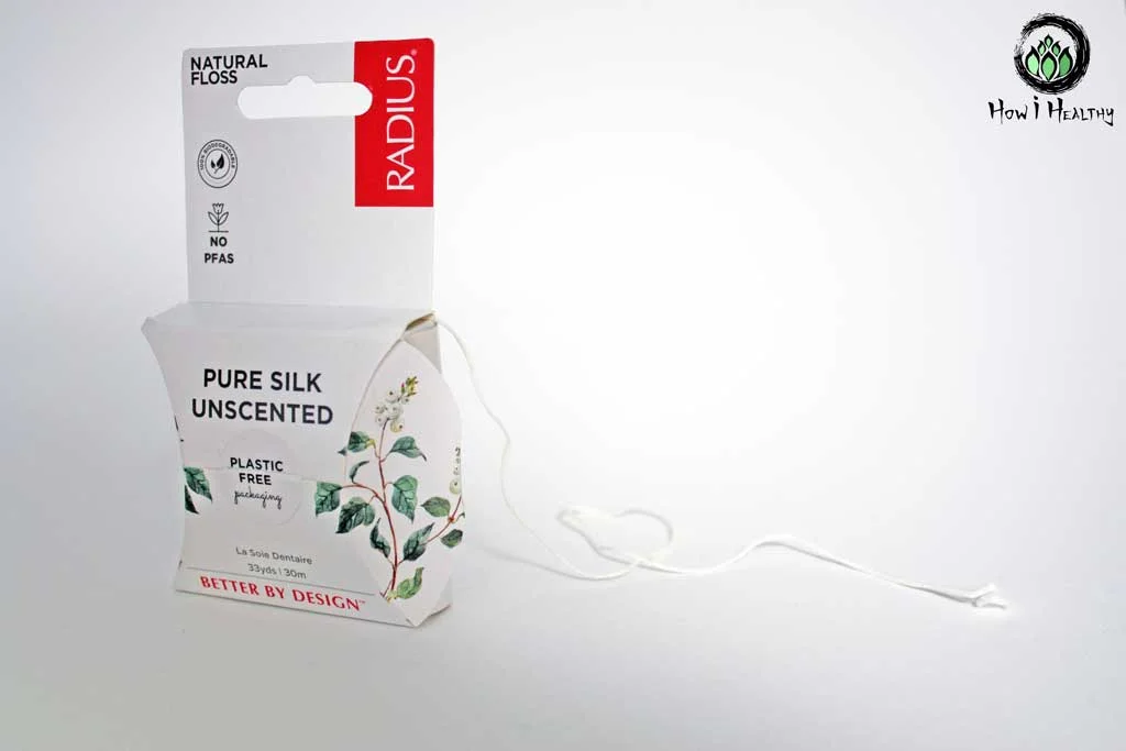 Silk Floss Plastic Free Eco-Friendly, Water-Free, Zero Waste Teeth & Oral Care (& Why It Matters) RADIUS® white silk floss coming out of paper product box.
